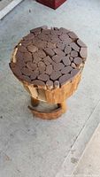 Top view of stool showing mosaic log slice seat and general condition