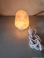 Lamp illuminated on tabletop showing crystal form and glow