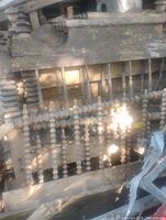 Pile of three antique turned wood bed frames showing spindle headboards and footboards