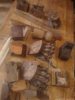 Top view of entire lot displaying assorted claw feet, blocks and moulding strips