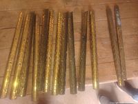 Brass stair caps laid out showing pattern and holes