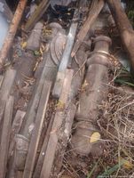 Pile of turned wooden newel posts and lumber pieces