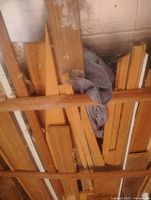 Stacked boards of mixed species in rafters