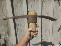 Front view of pickaxe head showing pointed and adze ends