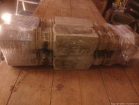 Four chunky antique wooden legs wrapped together