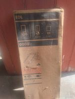 Front view of sealed EDL skylight box with model codes visible