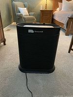 Full view of Honeywell tower air purifier front with power cord