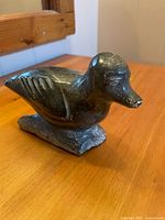 Front three-quarter view of soapstone bird carving