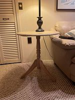 Full view of wooden side table beside sofa