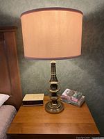 Lamp on bedside table showing overall appearance with shade lit