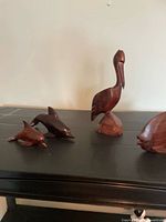 group view of all four wooden animal figures