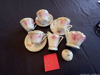 Full view of tea set pieces on table