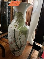 Front view showing full painted scene and shape