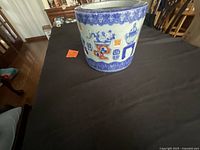 Overall view of porcelain pot showing decorative motifs and shape