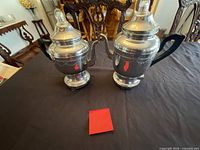Both chrome electric percolators on table