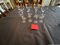 Front angle showing all 10 clear stemmed glasses