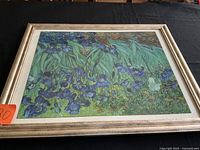Full view of framed Van Gogh "Irises" print on black table