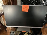 Front view of HP monitor showing screen and HP logo