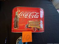 front view showing Coca-Cola graphics and overall shape