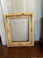 Front view of ivory ornate picture frame