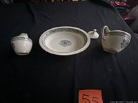 Tray, creamer, sugar bowl and lid displayed