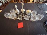 Group showing Lenox vases, sugar bowl, stemless glasses, shot glasses, cut-glass dish