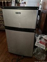 Front view showing stainless finish, dual doors, Element logo