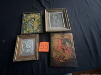 All four framed pieces arranged on table