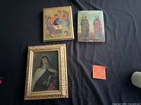 All three framed religious icons displayed together for scale and condition