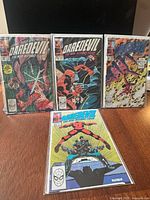 Front view of four Daredevil comics in sleeves