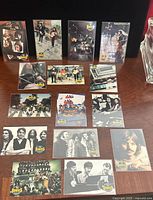All 15 Beatles trading cards laid out front side