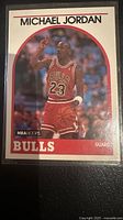 Front view of Michael Jordan NBA Hoops card #200 in plastic holder