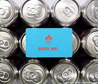 Front of blue Dominion City Brewing Co. gift card on beer cans