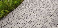 Grey interlocking Eco Optic 80 paving stones installed in walkway