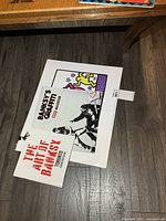 Calendar, poster and guide shown together on floor