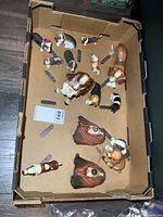 Tray overview showing all dog figurines and Bossons heads