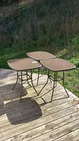 All three matching glass-top patio tables on deck