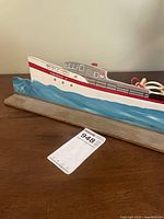 Full view of plywood ship lamp on base with cord visible