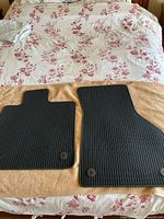 Both Audi TT floor mats laid flat showing overall shape and condition