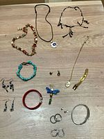 Full lot overview showing all jewellery pieces laid out