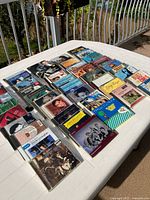 Wide view of entire assortment of CDs on table