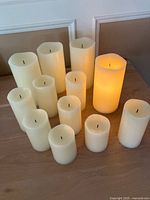 Twelve ivory flameless candles displayed on table