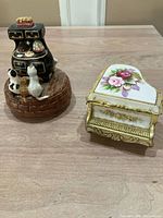 Overview of both music boxes on table