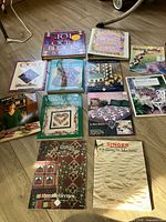 All twelve quilting books laid out on floor