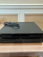 Front view of Sony CDP-C325 CD player with power cord on top