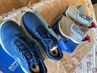 Both pairs of shoes on boxes (blue and grey) showing overall appearance