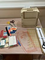 Overall lot with organizer, rulers, scissors, curve, marker and packaged trims