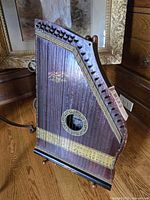 Front view of mandolin harp on stand