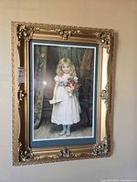 Full view of framed portrait on wall