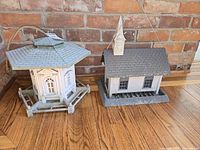 Gazebo and church bird feeders side by side showing scale, shape and condition